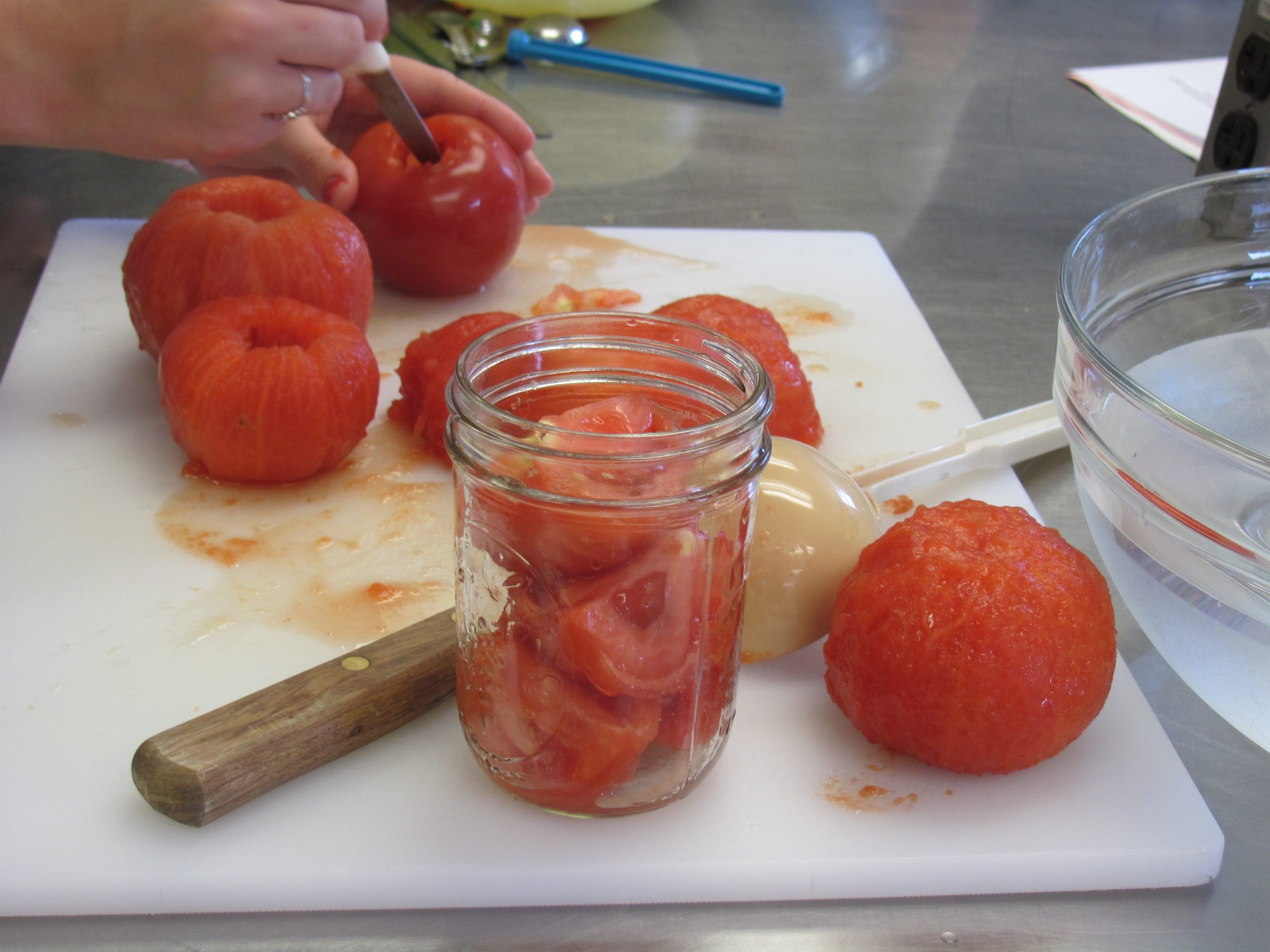 tomatoes on cutting board and in mason jar